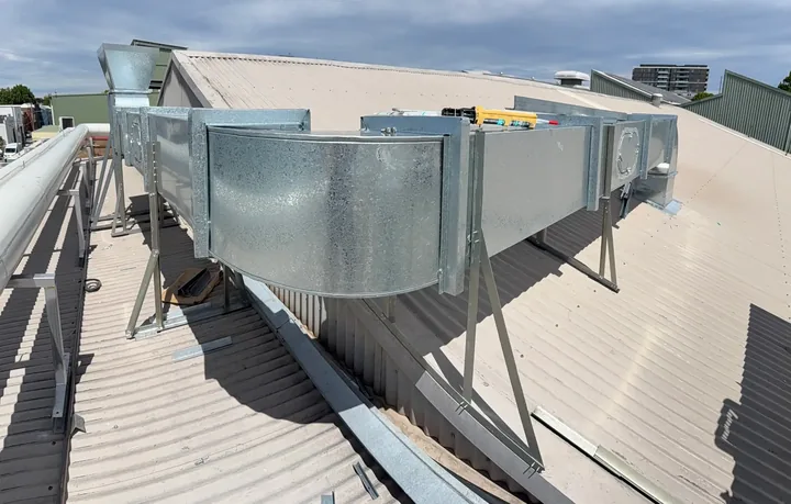 Commercial exhaust fans and ductwork on a rooftop